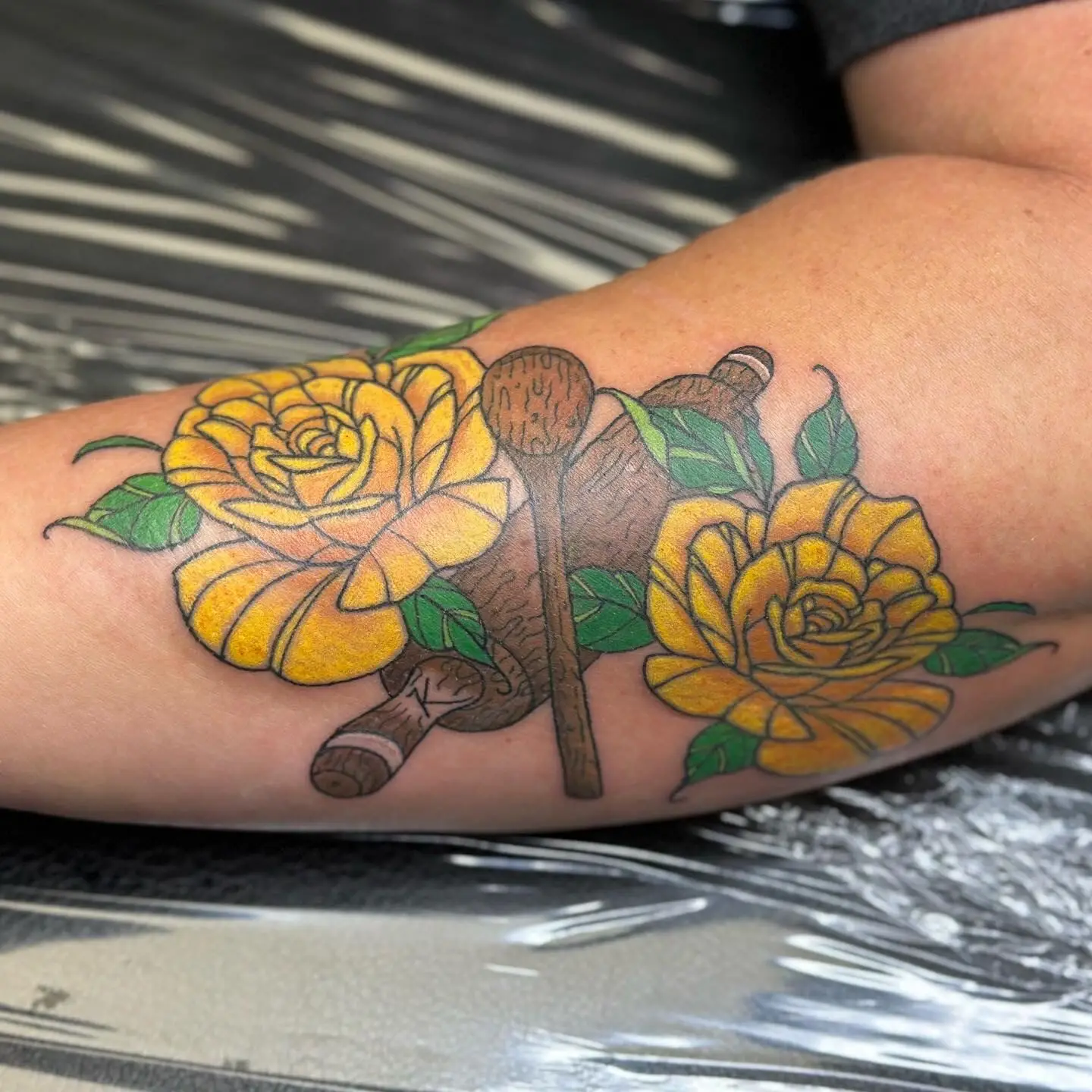 Neo traditional yellow roses with wooden rolling pin and spoon tattoo on inner bicep